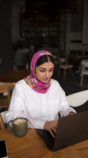 medium-shot-woman-working-with-hijab-indoors